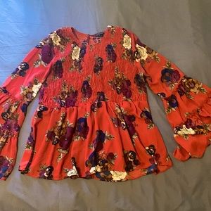 Smocked, bell sleeve blouse.